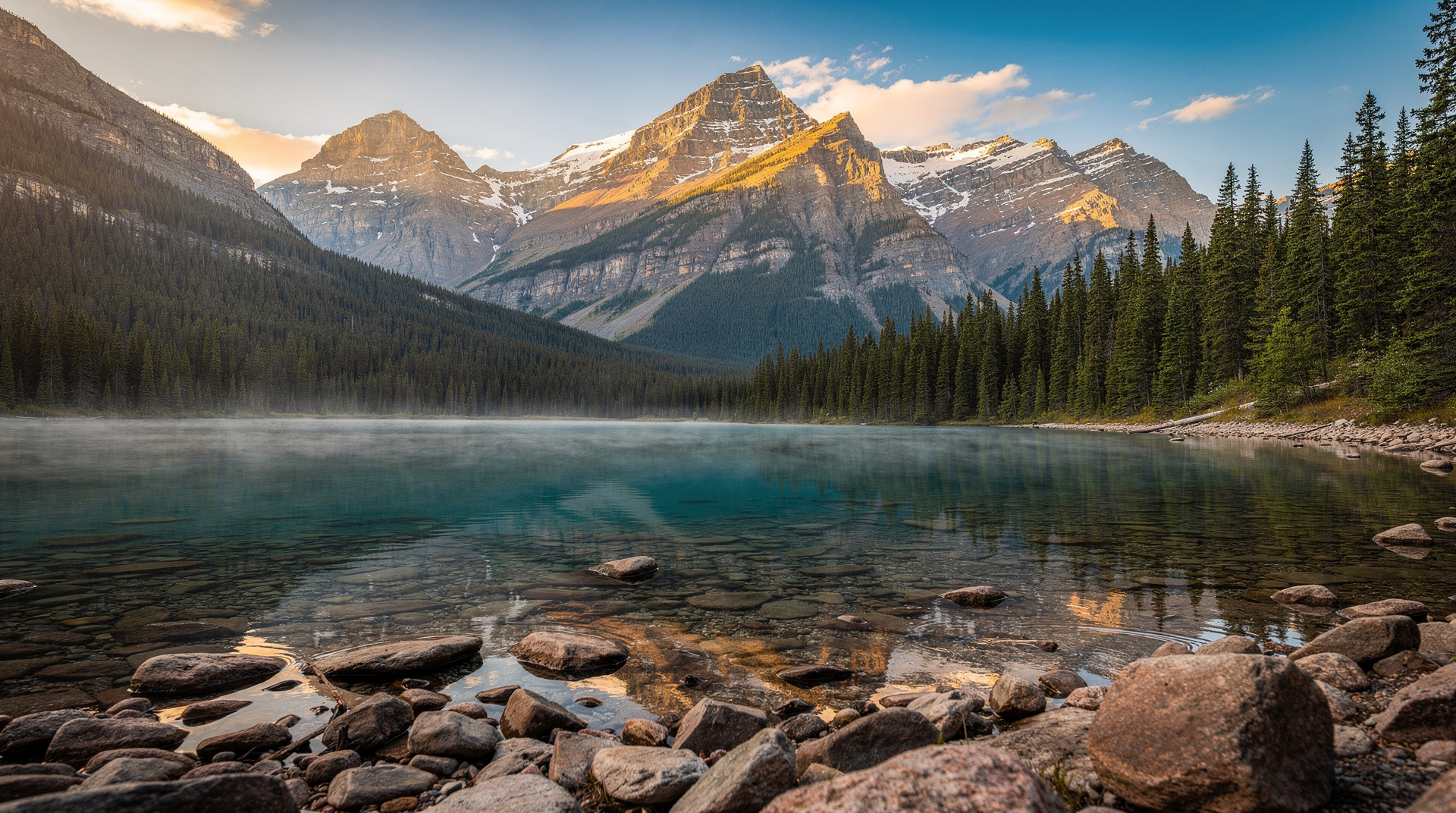 Parc National des Hautes-Gorges protects Quebec's deepest canyon — walls rise 900m from the Malbaie River, accessible by boat cruise, hiking, and kayak.